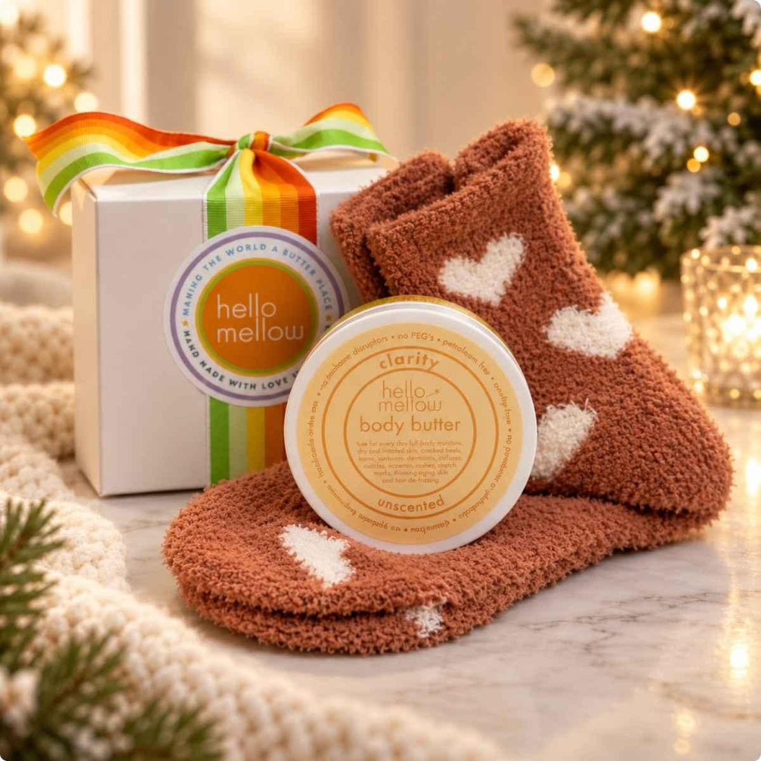 clarity unscented 2 oz body butter and cozy sock gift wrapped in holiday setting
