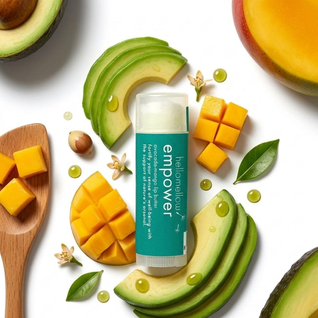 empower lip butter set against fresh avocados and mangos