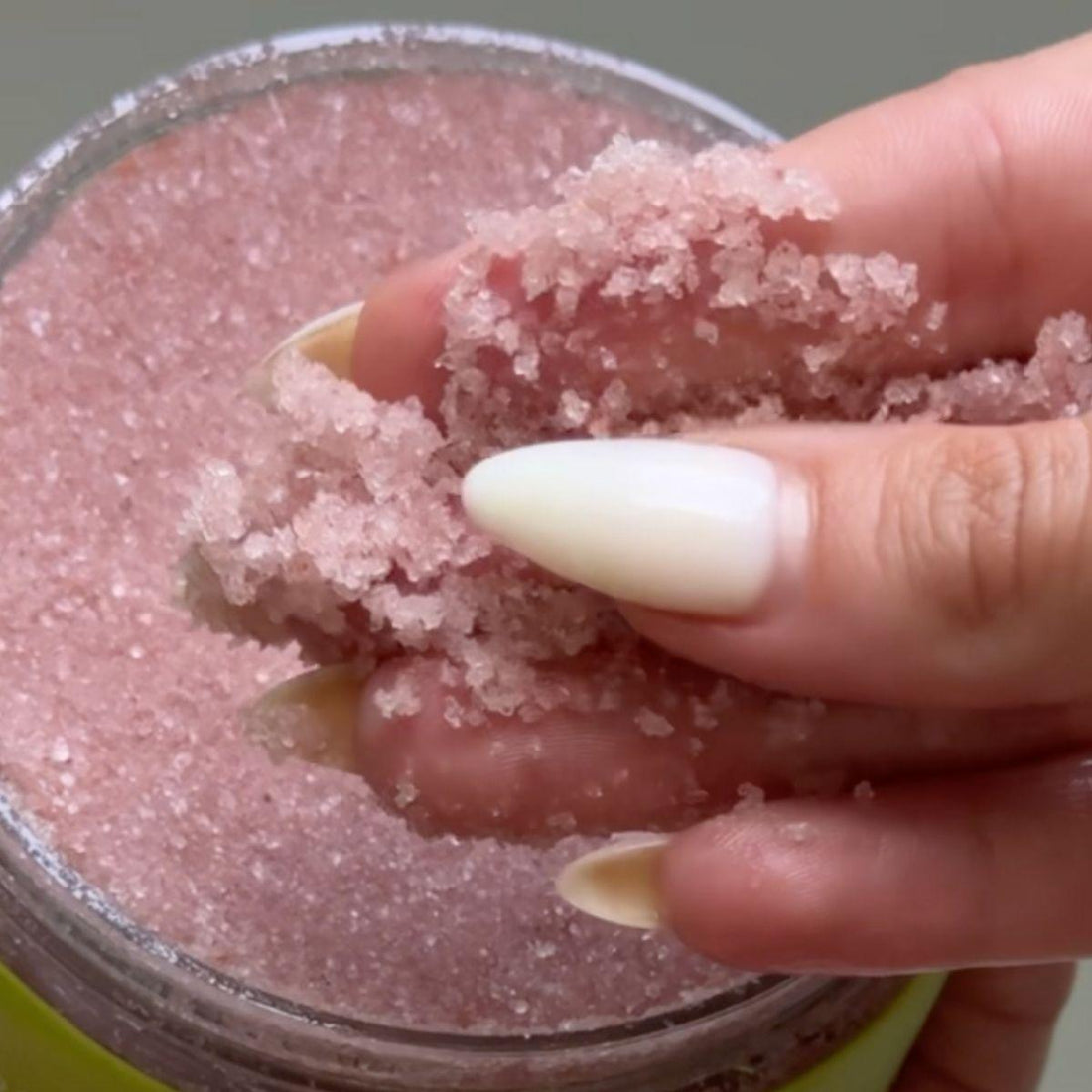 up close view of revitalize body scrub pink himalayan sea salt texture
