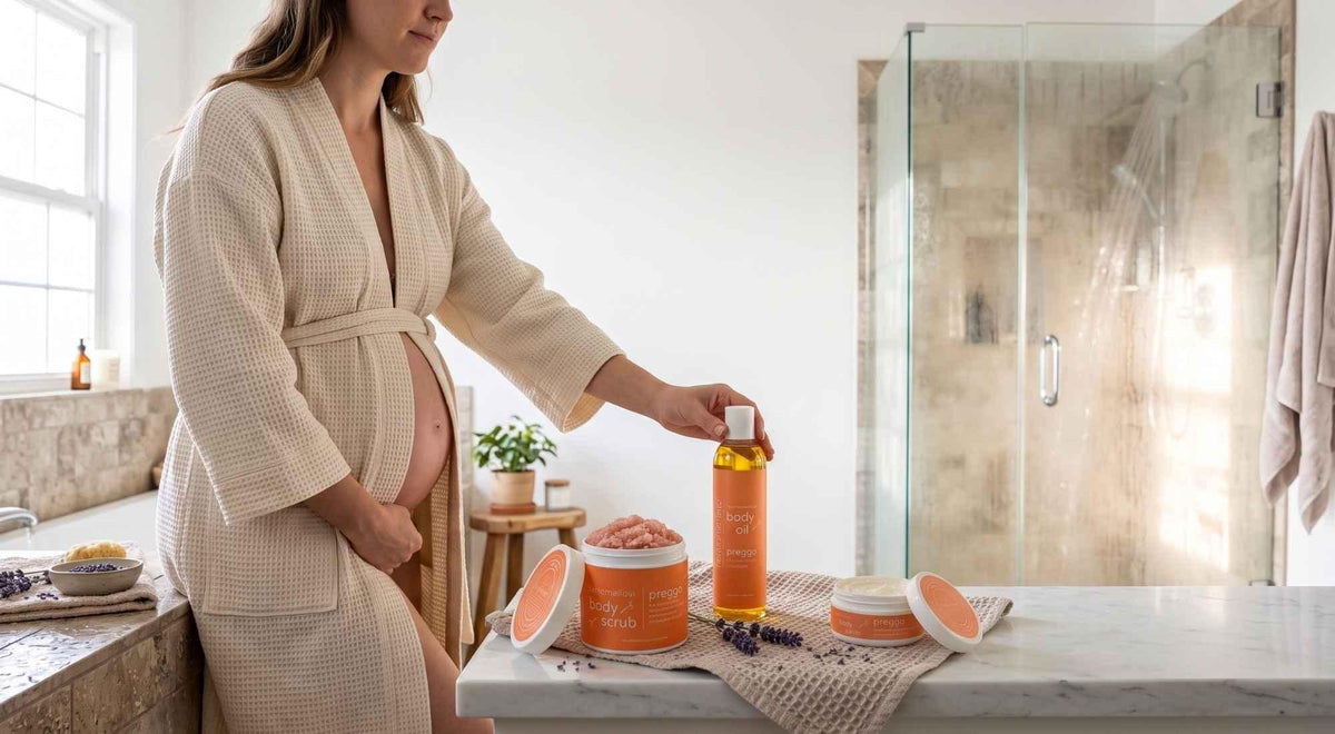 pregnant woman reaching for body oil beside body scrub and body butter in a bright bathroom.
