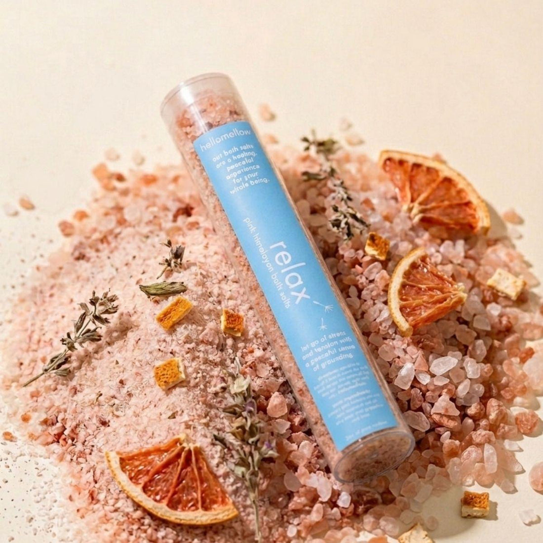 one shot bath salt in relax aroma sitting a mound of himalayan pink salt 