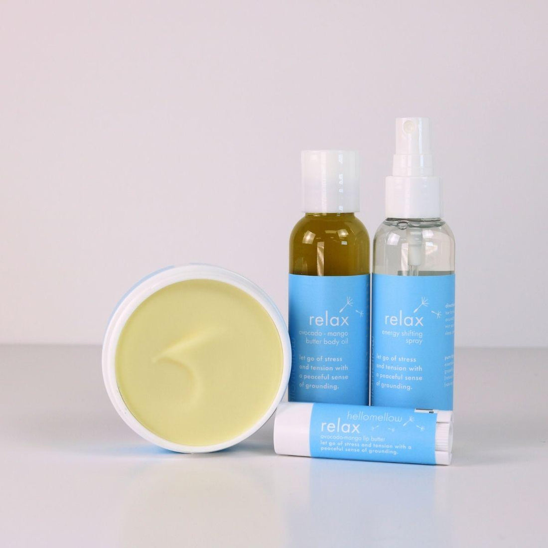 relax vacay vibe full product lineup with an open body butter, body oil, energy shifting aromatherapy spray, lip butter 
