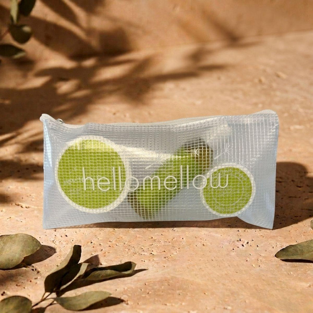 revitalize essential routine mini in hellomellow branded travel bag in an outdoor setting