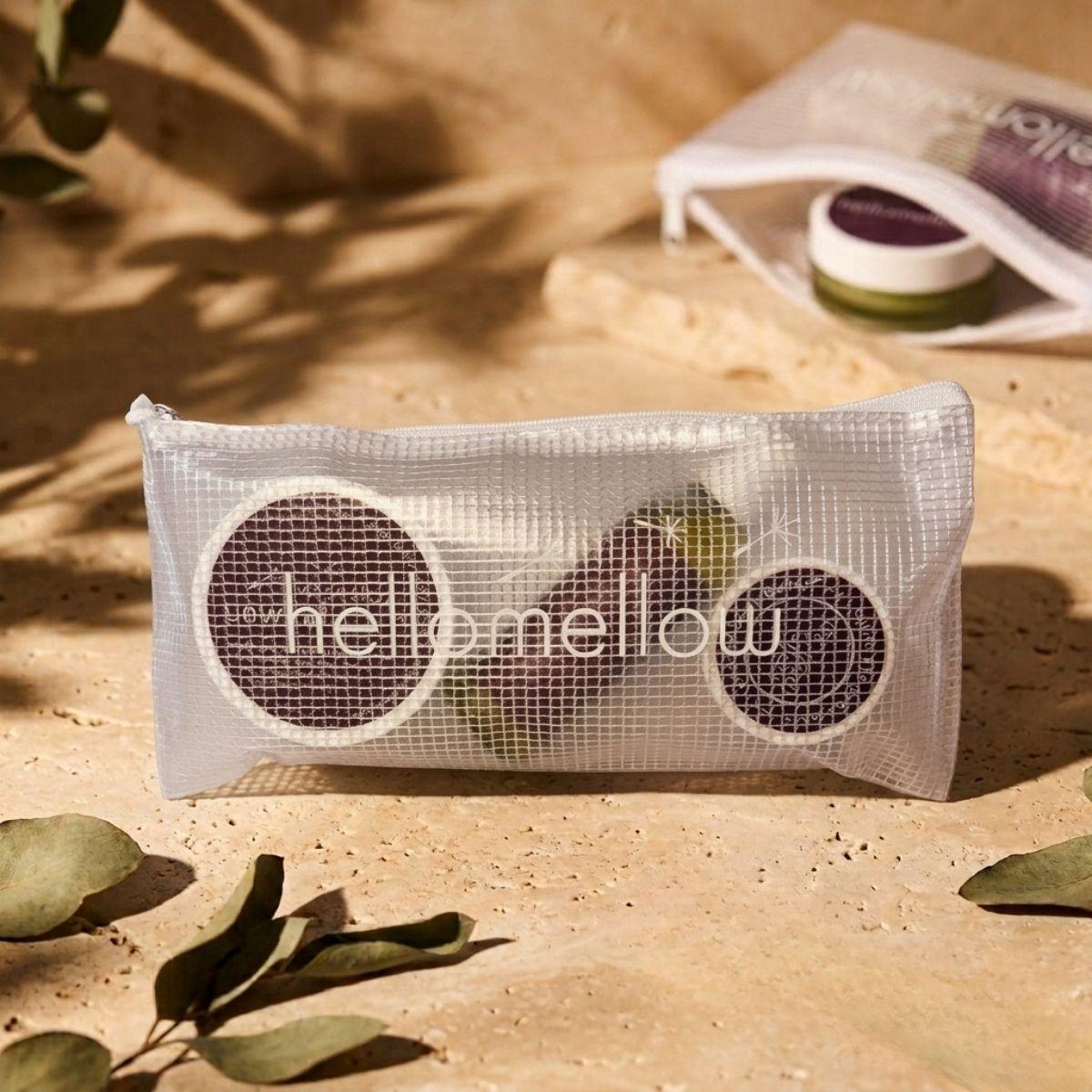 the essential routine mini unwind: mini body scrub, mini body oil and mini body butter, with the free hellomellow bag