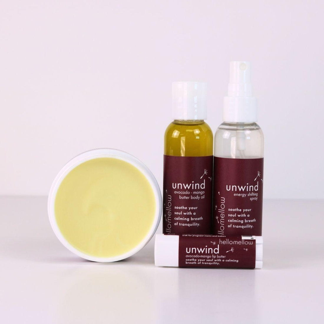 unwind vacay vibe full product lineup with an open body butter, body oil, energy shifting aromatherapy spray, lip butter 