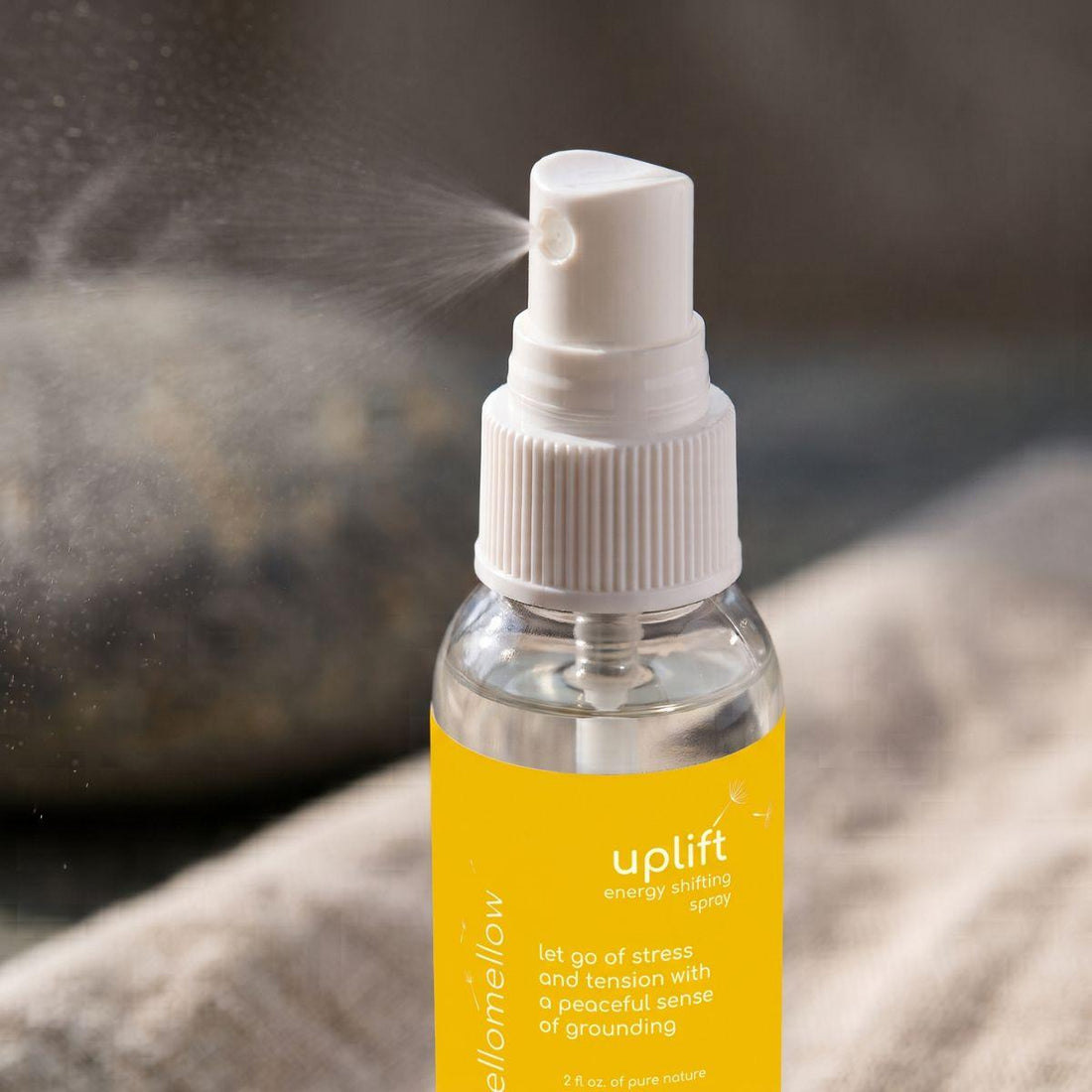 close view of the uplift energy shifting spray bottle and its real spray top